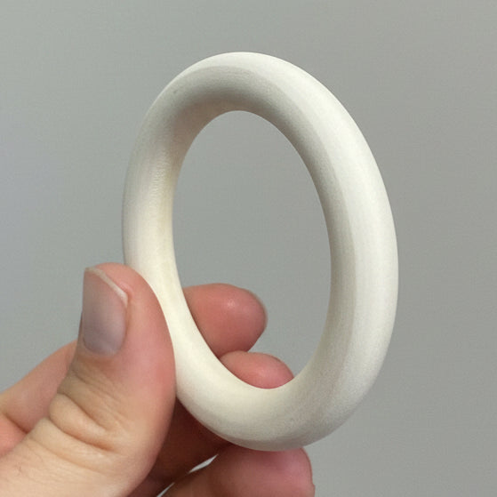 A wooden ring for handicraft and Toys. side profile.