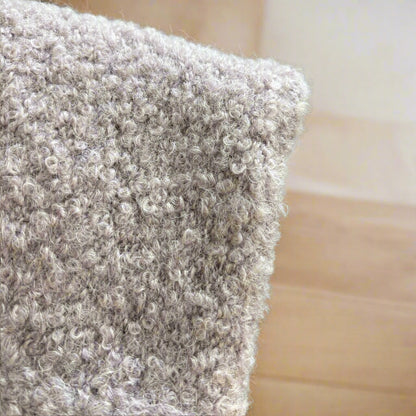 A classic redefined. Bouclé texture in a soft grey shade.