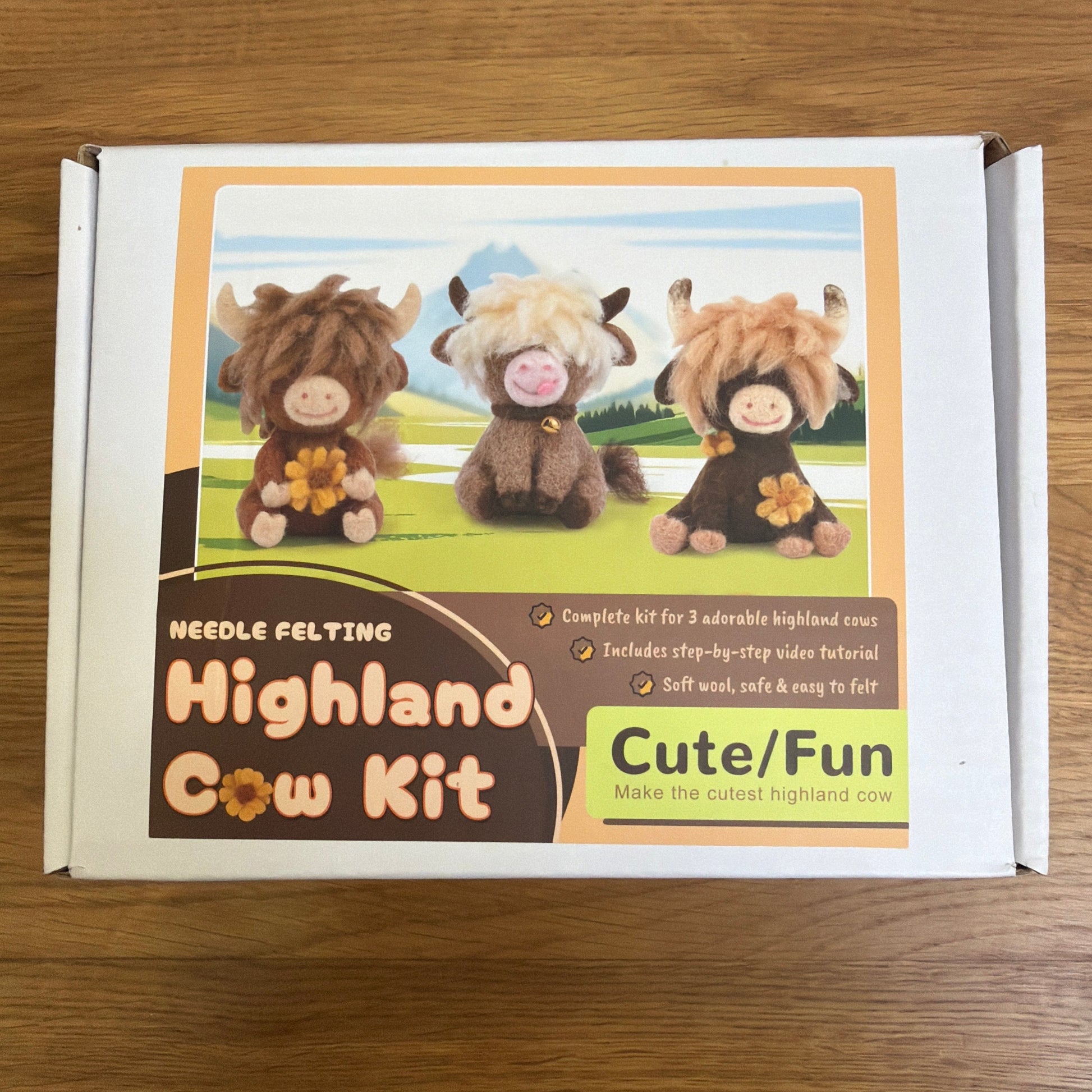A felting needle set + instructions to create 3 cute highland cows.