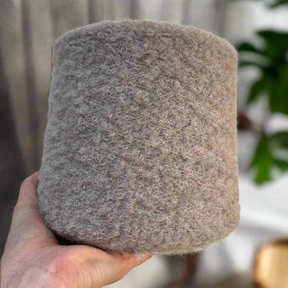 One cone, endless possibilities. 1 kg of natural softness and quality in superfine alpaca bouclé yarn.