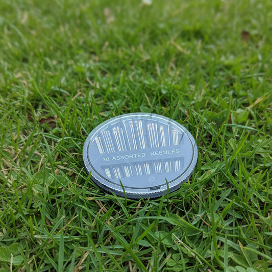 A set of 30 sewing needles on a casing. Natural picture from the nature.